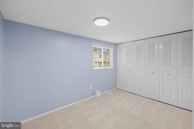8318 Brookvale Ct, Springfield, VA 22153 - unfurnished bedroom featuring a textured ceiling, carpet floors, and a closet