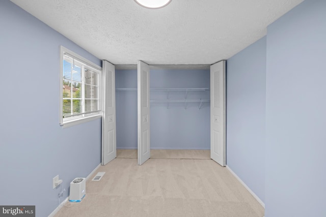 8318 Brookvale Ct, Springfield, VA 22153 - unfurnished bedroom with carpet floors, a closet, and a textured ceiling
