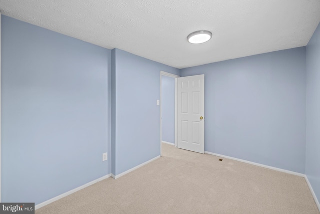 8318 Brookvale Ct, Springfield, VA 22153 - carpeted empty room with baseboards and a textured ceiling