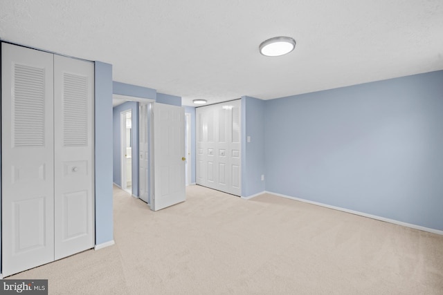 8318 Brookvale Ct, Springfield, VA 22153 - unfurnished bedroom featuring carpet floors and multiple closets