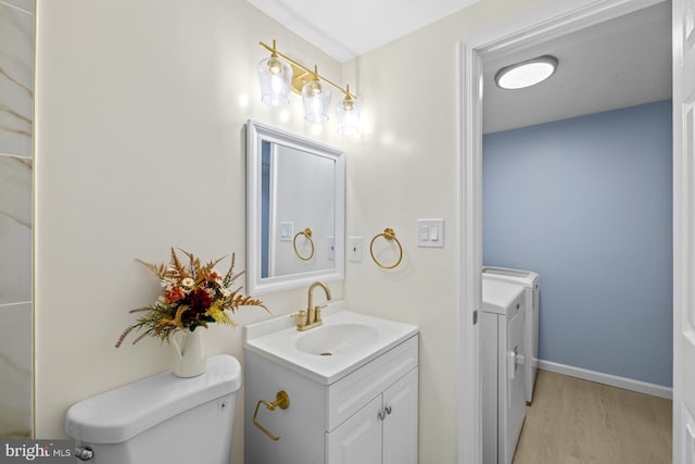 8318 Brookvale Ct, Springfield, VA 22153 - bathroom featuring vanity, wood finished floors, and washer and clothes dryer