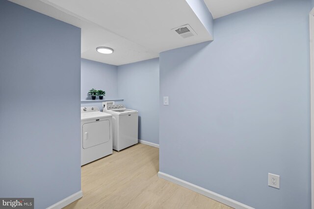 8318 Brookvale Ct, Springfield, VA 22153 - washroom with washer and dryer and light wood-type flooring