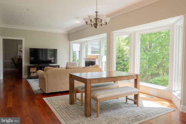3259 Chrisland Dr, Annapolis, MD 21403 - dining space with plenty of natural light, a chandelier, crown molding, and dark wood-style floors