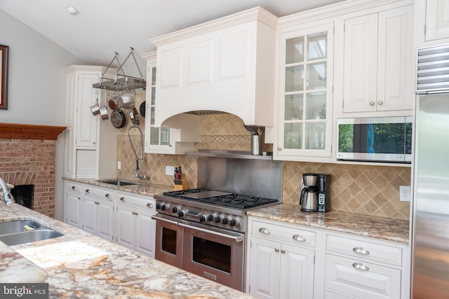 3259 Chrisland Dr, Annapolis, MD 21403 - kitchen with high quality appliances, backsplash, glass insert cabinets, and white cabinets