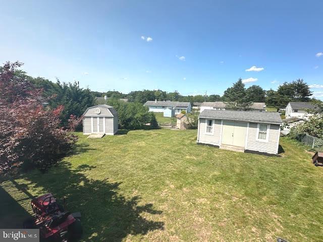 32 Saranac Rd, Hamilton, NJ 08619 - view of grassy yard featuring a storage shed