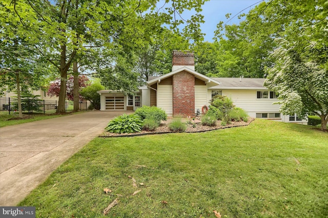 1134 William St, State College, PA 16801 - view of front facade with a chimney and concrete driveway