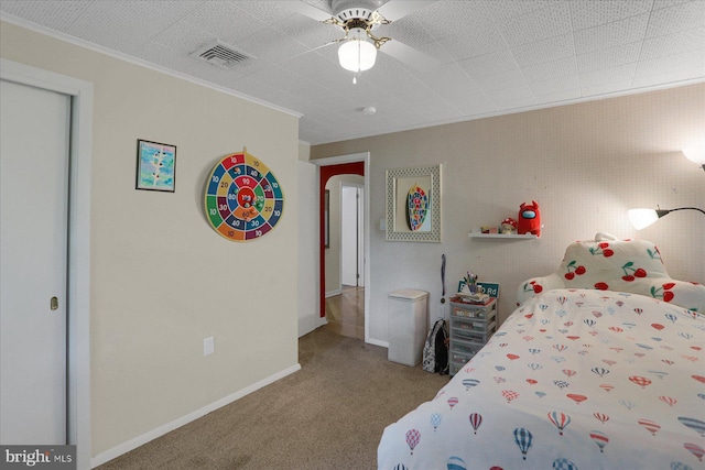 1134 William St, State College, PA 16801 - carpeted bedroom with arched walkways, crown molding, and a ceiling fan