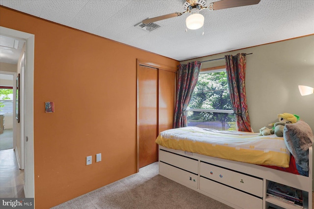 1134 William St, State College, PA 16801 - bedroom with light colored carpet, a closet, and ceiling fan