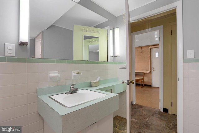 1134 William St, State College, PA 16801 - bathroom with tile walls, vanity, and stone finish flooring