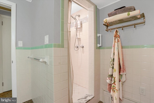 1134 William St, State College, PA 16801 - bathroom with tile walls, a shower stall, and wainscoting