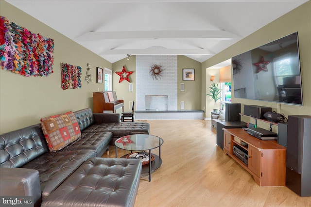 1134 William St, State College, PA 16801 - living room with light wood-type flooring and a brick fireplace