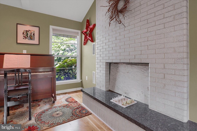 1134 William St, State College, PA 16801 - office space featuring wood finished floors, a fireplace, and lofted ceiling