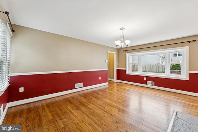 5 Brookfield Rd, Pasadena, MD 21122 - unfurnished room featuring a chandelier and wood finished floors