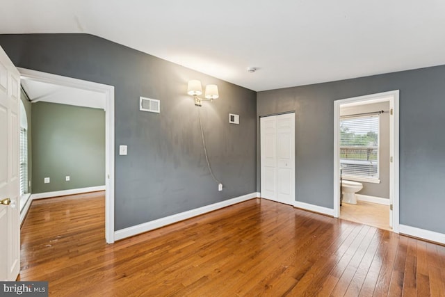 5 Brookfield Rd, Pasadena, MD 21122 - unfurnished room with hardwood / wood-style flooring and vaulted ceiling