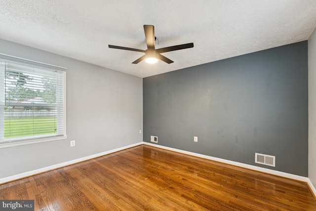 5 Brookfield Rd, Pasadena, MD 21122 - unfurnished room featuring ceiling fan, wood finished floors, and a textured ceiling