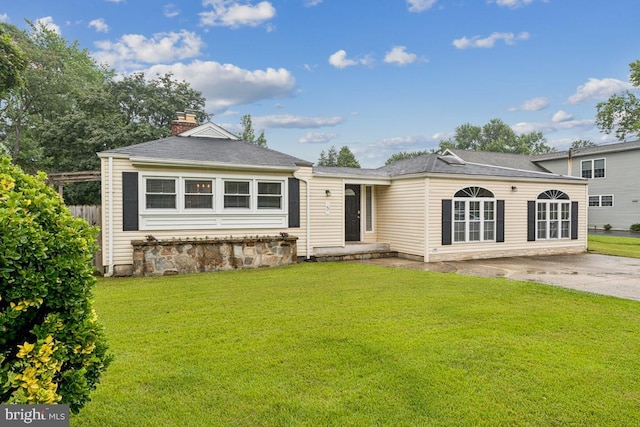 5 Brookfield Rd, Pasadena, MD 21122 - view of front facade with a front lawn and a chimney