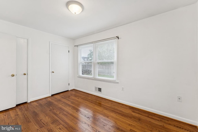 5 Brookfield Rd, Pasadena, MD 21122 - unfurnished bedroom featuring wood finished floors and baseboards