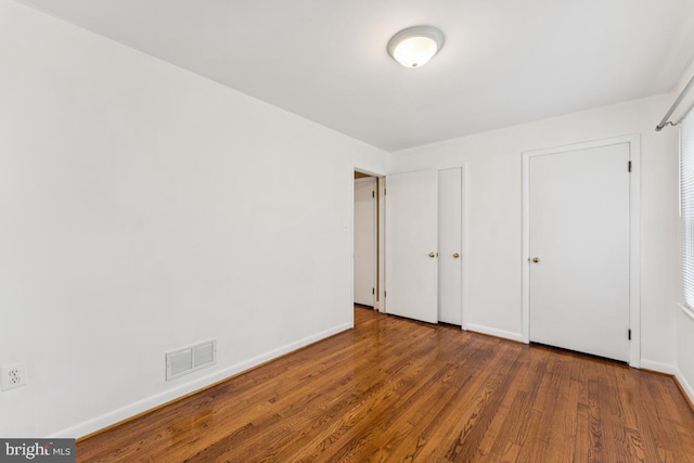 5 Brookfield Rd, Pasadena, MD 21122 - unfurnished bedroom with wood finished floors and baseboards