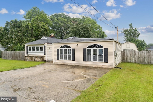 5 Brookfield Rd, Pasadena, MD 21122 - back of property featuring asphalt driveway and a patio area