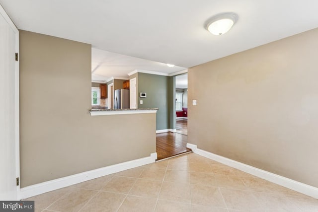 5 Brookfield Rd, Pasadena, MD 21122 - spare room with light tile patterned floors and ornamental molding