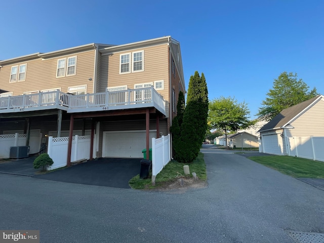 461 Clayhall St, Gaithersburg, MD 20878 - back of property with a garage and asphalt driveway