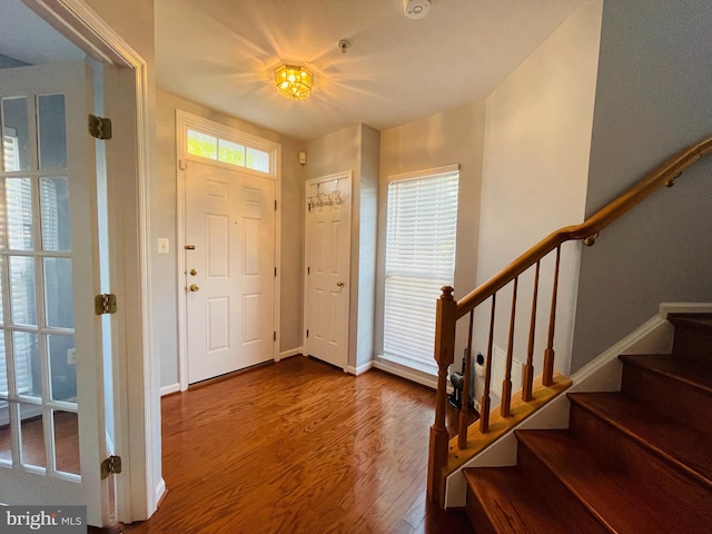 461 Clayhall St, Gaithersburg, MD 20878 - entryway with wood finished floors and stairs