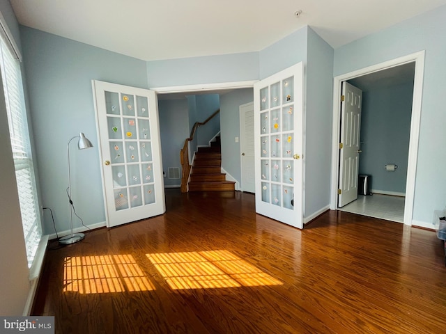 461 Clayhall St, Gaithersburg, MD 20878 - spare room with wood finished floors, stairs, and fire sprinkler in ceiling