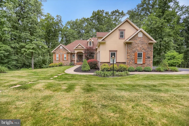 282 Timberton Cir, Bellefonte, PA 16823 - traditional-style house with stone siding, stucco siding, and a front lawn