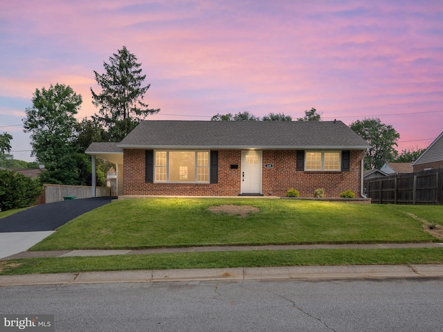 105 Bette Rd, Wilmington, DE 19803 - view of front of house featuring asphalt driveway, brick siding, and a carport