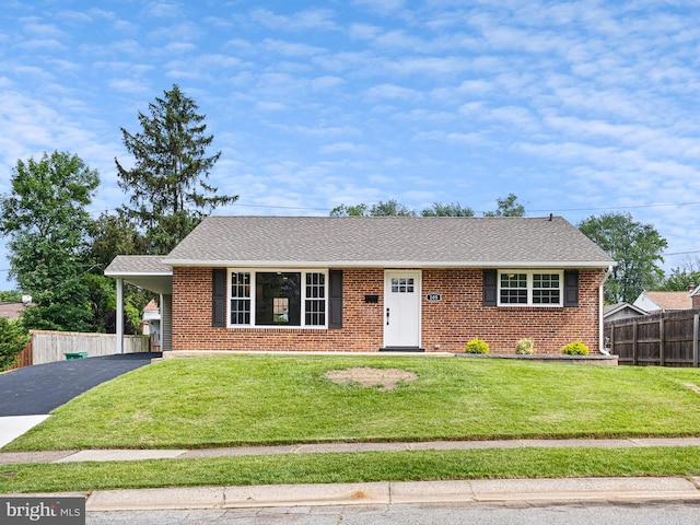 105 Bette Rd, Wilmington, DE 19803 - view of front of property featuring brick siding, driveway, an attached carport, and a shingled roof
