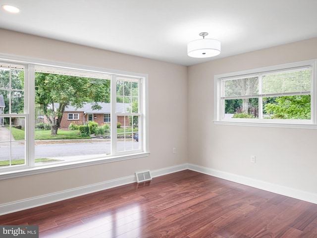 105 Bette Rd, Wilmington, DE 19803 - empty room featuring plenty of natural light and dark wood finished floors