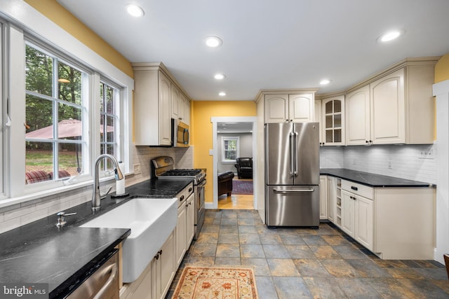 136 Lambs Rd, Sewell, NJ 08080 - kitchen with appliances with stainless steel finishes, plenty of natural light, recessed lighting, cream cabinets, and tasteful backsplash