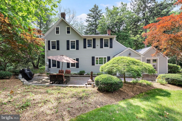 136 Lambs Rd, Sewell, NJ 08080 - back of house with a chimney and a patio