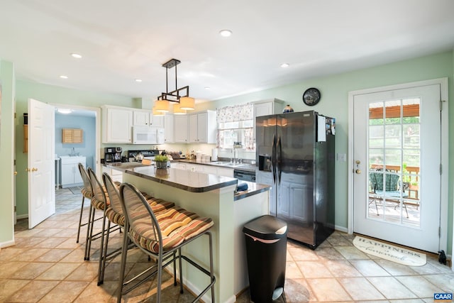 1500 Honeysuckle Ln, Charlottesville, VA 22902 - kitchen featuring white microwave, stainless steel refrigerator with ice dispenser, washer and dryer, plenty of natural light, and recessed lighting