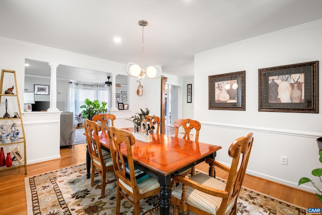 1500 Honeysuckle Ln, Charlottesville, VA 22902 - dining space featuring light wood-style flooring, ornamental molding, decorative columns, and a ceiling fan