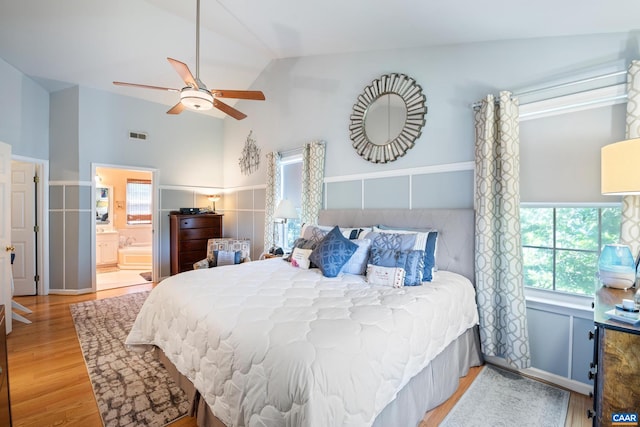 1500 Honeysuckle Ln, Charlottesville, VA 22902 - bedroom with wood finished floors, ensuite bathroom, high vaulted ceiling, and ceiling fan