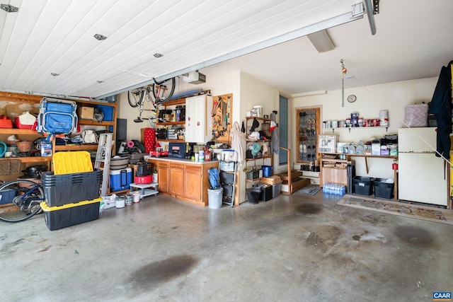 1500 Honeysuckle Ln, Charlottesville, VA 22902 - garage featuring a workshop area and freestanding refrigerator