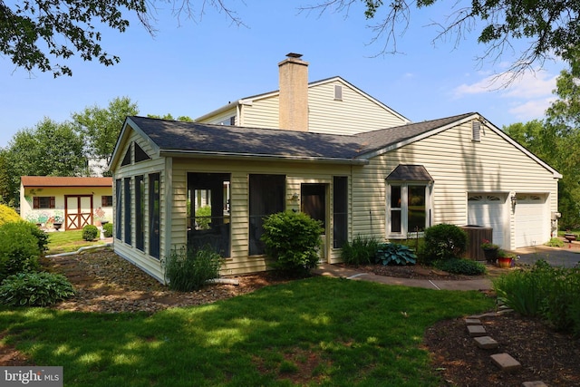 2050 Creek Way, Lansdale, PA 19446 - view of front of house with an attached garage, driveway, a chimney, a front yard, and roof with shingles