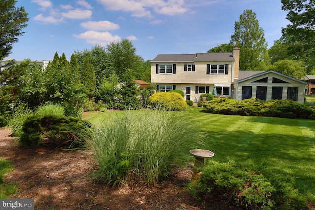 2050 Creek Way, Lansdale, PA 19446 - rear view of house with a chimney and a lawn