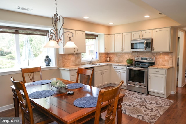 2050 Creek Way, Lansdale, PA 19446 - kitchen featuring stainless steel appliances, dark wood-style floors, decorative backsplash, white cabinetry, and recessed lighting