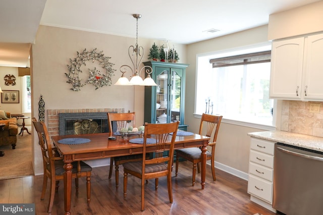 2050 Creek Way, Lansdale, PA 19446 - dining space featuring wood finished floors and a brick fireplace