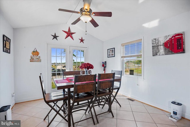 8255 Longpoint Rd, Baltimore, MD 21222 - dining space featuring healthy amount of natural light, light tile patterned floors, vaulted ceiling, and a ceiling fan
