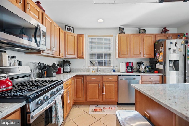 8255 Longpoint Rd, Baltimore, MD 21222 - kitchen featuring stainless steel appliances, light tile patterned flooring, and light stone countertops