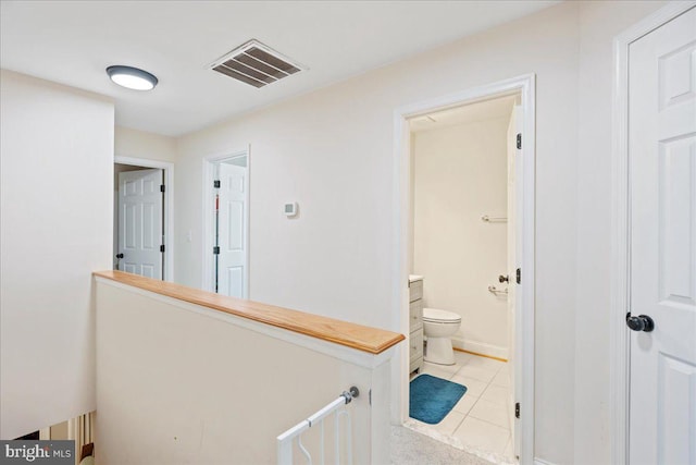 8255 Longpoint Rd, Baltimore, MD 21222 - corridor featuring light tile patterned floors and an upstairs landing