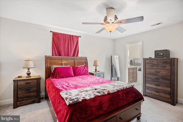 8255 Longpoint Rd, Baltimore, MD 21222 - bedroom with light carpet, ensuite bath, and a ceiling fan