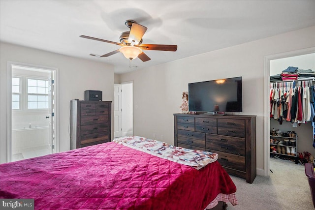 8255 Longpoint Rd, Baltimore, MD 21222 - bedroom featuring a walk in closet, carpet floors, a closet, ensuite bathroom, and a ceiling fan