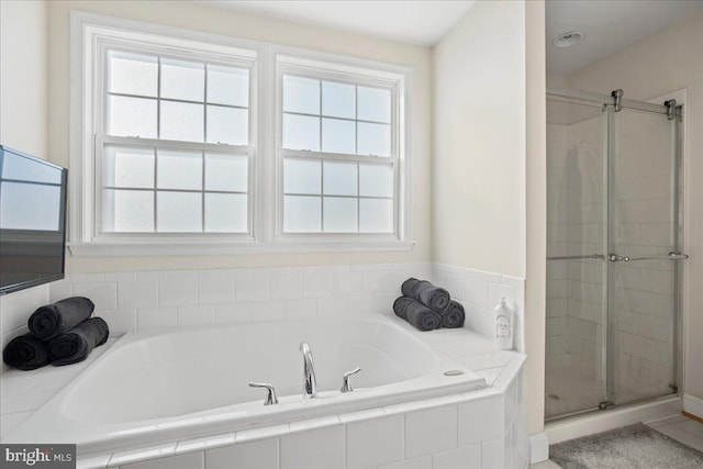 8255 Longpoint Rd, Baltimore, MD 21222 - full bathroom featuring a garden tub, a stall shower, and healthy amount of natural light