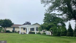 15861 Union Chapel Rd, Woodbine, MD 21797 - back of property with a pergola and a yard