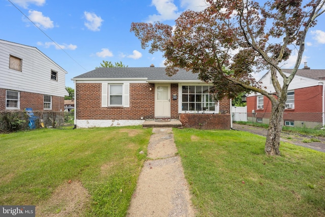 2301 Airacobra St, Levittown, PA 19057 - view of front of property with brick siding and roof with shingles