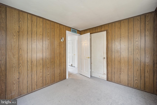 2301 Airacobra St, Levittown, PA 19057 - unfurnished bedroom with wooden walls and carpet floors